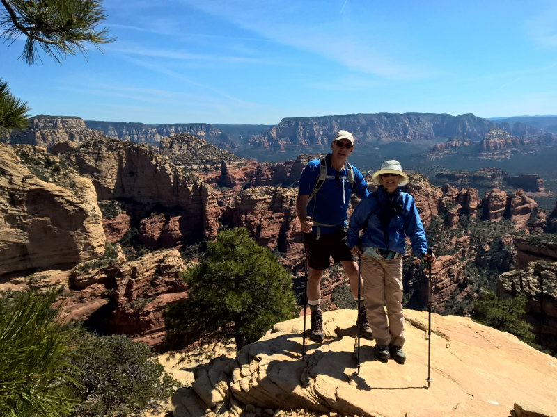 Hikers standing on a rocky overlook
